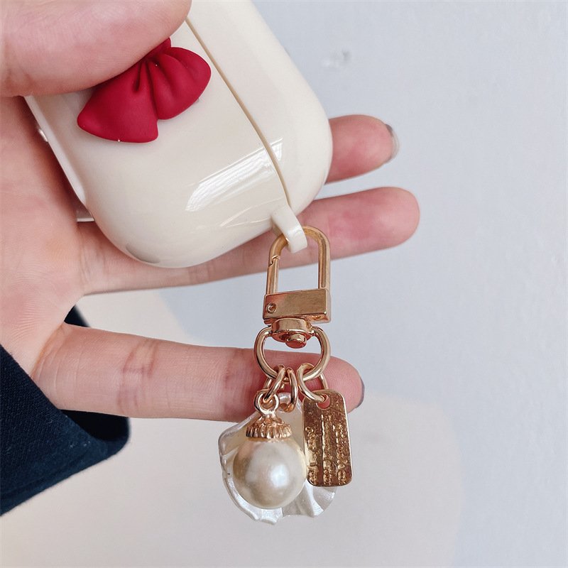 Beige Red Bow Shell Pendant Wireless Earphone Case - Image 2